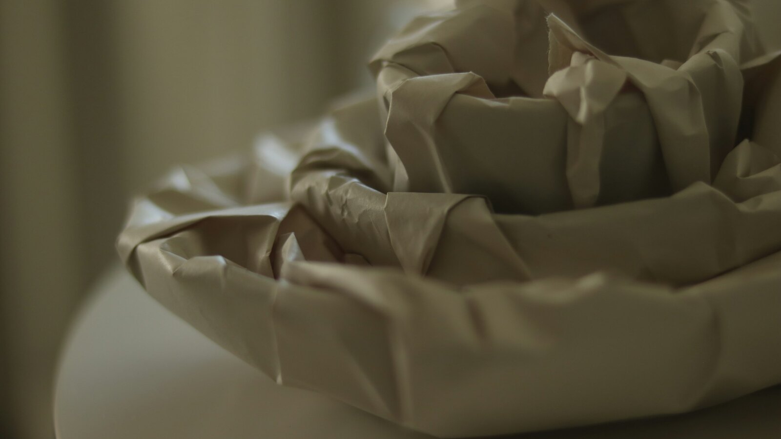Soft neutral folded fabric still life